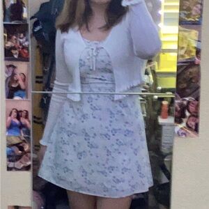 White dress with blue flowers. Zip up in the back. Size Large